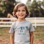 Kinder Cool Dinosaur Dig Skeleton Boys T-Shirt<br><div class="desc">Dieses niedliche personalisierte Shirt verfügt über ein blaues prähistorisches Dinosaurier-Fossil. Es gibt auch Platz für Sie,  Ihren Jungs Namen hinzuzufügen,  in whimsical Typografie. Das perfekte Dinosauriergeschenk für alle Archäologen und Dinosaurier-Liebhaber,  ideal für Kleinkinder und ältere Kinder.</div>