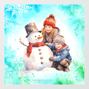 Kinder, die einen Schneemann machen Fensteraufkleber