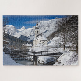 Kirche im Schnee mit den Alpen Puzzle