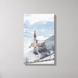 Kirche in einer alpinen Winterlandschaft Leinwanddruck