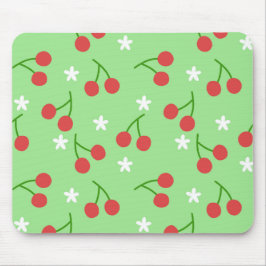 Kirschen und Mousepad mit weißer Blume