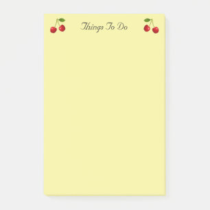 Kirschfrüchte auf gelben Dingen zu tun Post-it Klebezettel