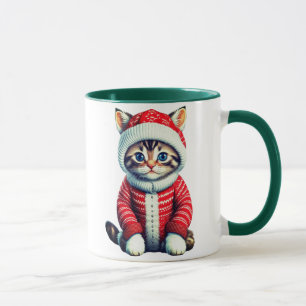 Kitten in einem rot-weißen Weihnachtskraut Tasse
