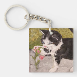 Kitten Playing mit rosa Blume Schlüsselanhänger