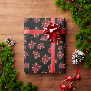 Klassischer Weihnachtsstern mit Goldspritzer auf S Geschenkpapier