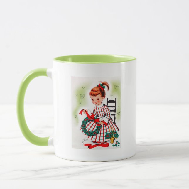 Klassisches Weihnachtskleines Mädchen mit Tasse (Links)