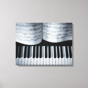 Klavier-Schlüssel und Musikbuch Leinwanddruck