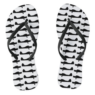 Kleine Flugzeug-Silhouette drehen Reinfälle um Flip Flops