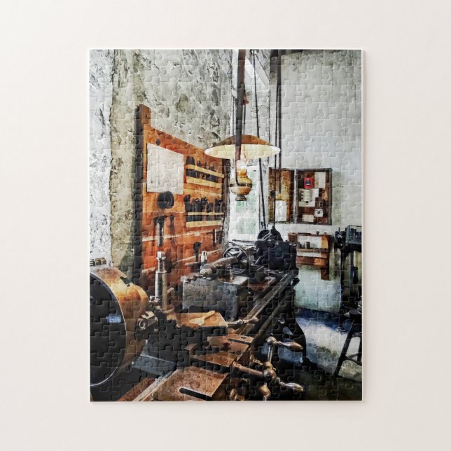 Kleine Laie im Maschinengeschäft Puzzle (Vertikal)