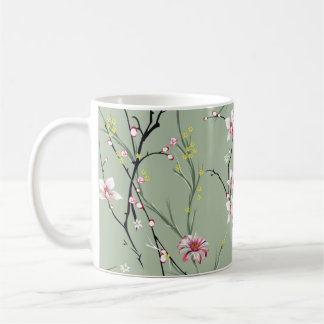 Kleine rote und gelbe Blume auf grünem Hintergrund Kaffeetasse