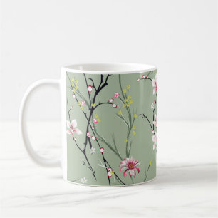 Kleine rote und gelbe Blume auf grünem Hintergrund Kaffeetasse