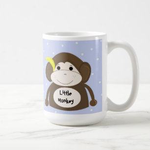 Kleiner Affe mit einer gelben Banane Tasse