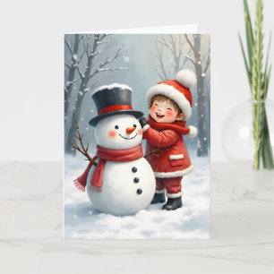 Kleiner Junge baut einen Schneemann Blanko-Weihnac Karte