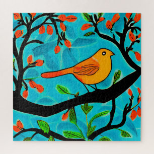 Kleiner Orangenvogel auf einer blühenden Branche Puzzle