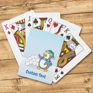 Kleiner Pinguin mit Schneebälle, der Kartenspiele  Spielkarten