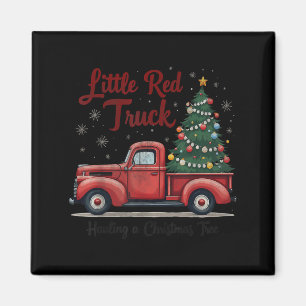 Kleiner roter LKW transportiert einen Weihnachtsba Magnet