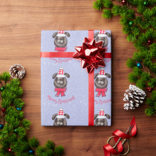 Kleiner Weihnachtshund mit gestrickter Mütze und S Geschenkpapier