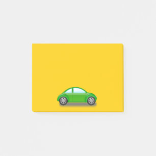 Kleines grünes Auto auf gelber Post-it-Notiz Post-it Klebezettel