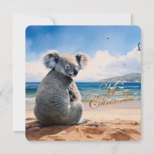 Koala an einem sandigen Strand Frohe Weihnachten