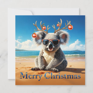 Koala an einem sandigen Strand Frohe Weihnachten
