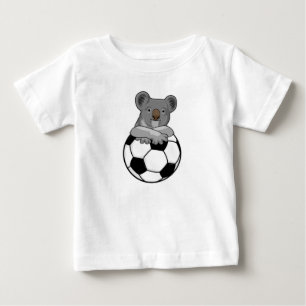 Koala beim Fußballsport Baby T-shirt