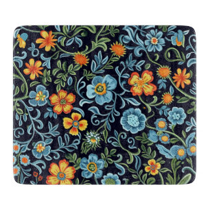 Komplexe Blumenkunst: Blaue und orangefarbene Blum Schneidebrett
