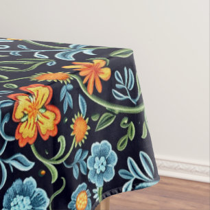 Komplexe Blumenkunst: Blaue und orangefarbene Blum Tischdecke
