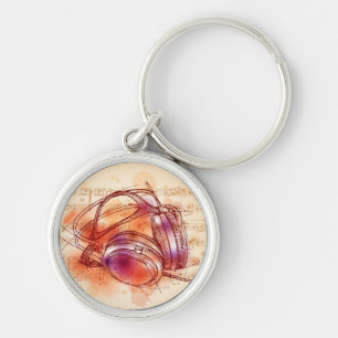 Kopfhörer auf einem Aquarellhintergrund u. Schlüsselanhänger