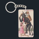 Krampus Scaring Girls Vintage Demon Christmas Schlüsselanhänger<br><div class="desc">Mit dieser Darstellung von Krampus bedroht er zwei kleine Mädchen. Ein Mädchen,  das sich bereits im Korb auf dem Rücken befindet,  und das andere beten vor ihm. Dieses Vintage Kunstwerk bietet eine einzigartige Möglichkeit,  Ihren Urlaubsgeist zu zeigen. Karo aus meinem Laden für Tonnen mehr große Vintage Krampusbekleidung und Accessoires!</div>