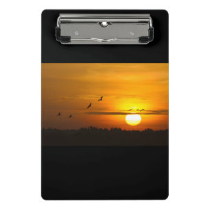 Krane bei Sonnenaufgang Mini Klemmbrett
