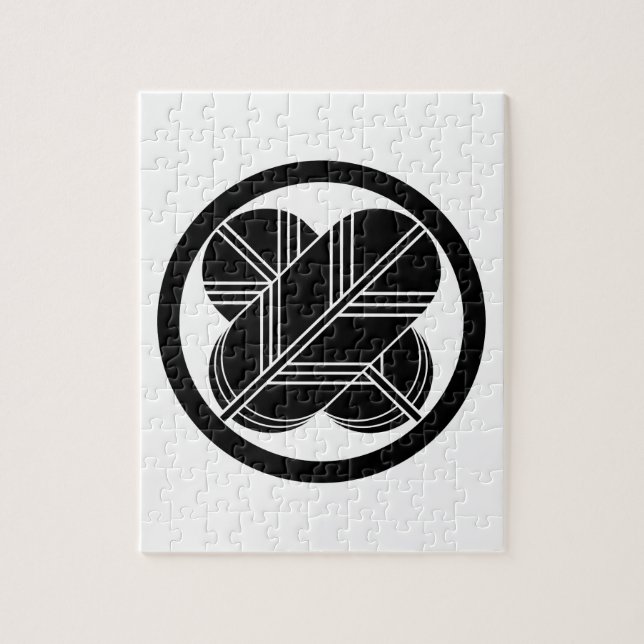 Kreuzende Falkenfedern mit Fuß im Kreis Puzzle (Vertikal)