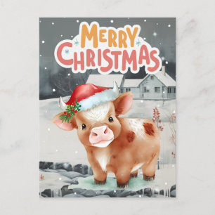 Kuh mit Weihnachtsmannmütze im Winter Feiertagspostkarte