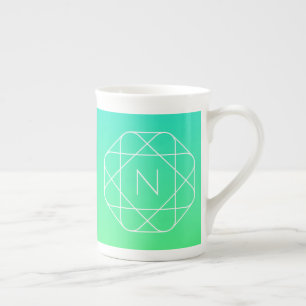 Kühles geometrisches Monogramm Blau und Limetten Prozellantasse