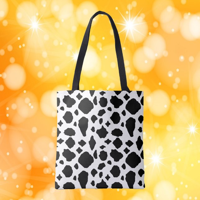 Kuhmuster Schwarz und Weiß (A tote bag with a black and white cow pattern)