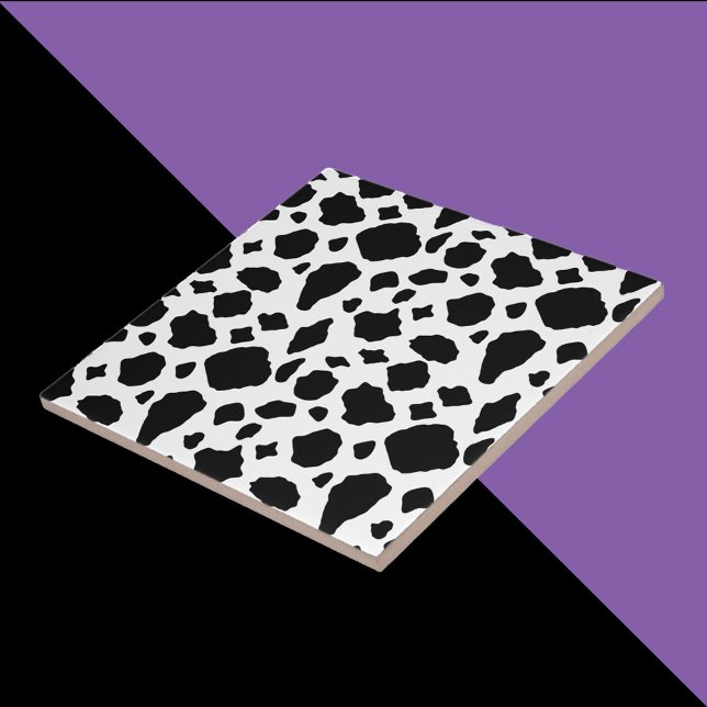 Kuhmuster Schwarz-Weiß-Land Fliese (A tile with a black and white cow pattern.)