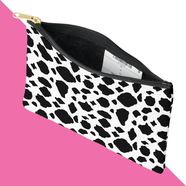 Kuhmuster Schwarz-Weiß-Land Zubehörtasche (An accessory bag with a black and white cow pattern.)