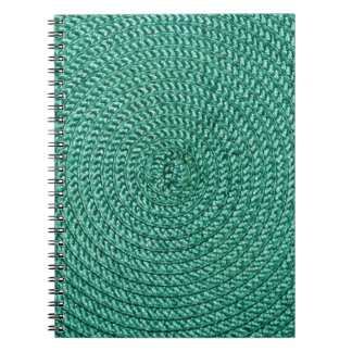 Künstlich geflochtene grüne Stoffstruktur. Notizblock