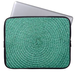 Künstliche geflochtene grüne Stofftextur. Laptopschutzhülle