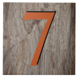 Kupfer Glow House Number Tile 7 auf grauem Stein Fliese