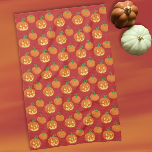Kürbislaternen-Küchenhandtuch mit Kürbismuster Geschirrtuch (Cute Halloween kitchen towel with a Jack-o-Lantern and pumpkin pattern .)