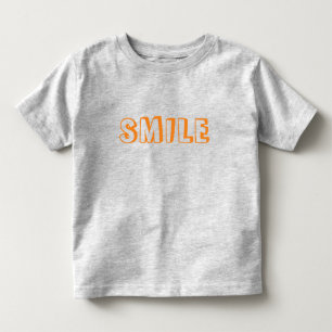 "Lächeln" orangefarbene Buchstaben grau Kleinkind T-shirt