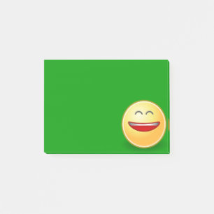 Lächelndes Gesicht auf grünem Post-it-Zettel Post-it Klebezettel