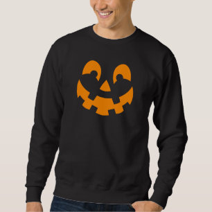 Lächelndes Halloween Kürbisgesicht in orangefarben Sweatshirt