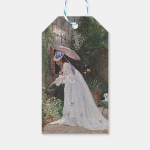 Lady in einem Garten Kümmerte für ihre Blume mit L Geschenkanhänger
