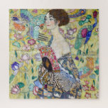 Lady mit einem Fan, Gustav Klimt Puzzle<br><div class="desc">Gustav Klimt (14. Juli 1862 - 6. Februar 1918) war ein österreichischer symbolischer Maler und einer der prominentesten Mitglieder der Wiener Sezessionsbewegung. Klimt ist bekannt für seine Gemälde, Wandgemälde, Skizzen und andere Kunstobjekte. Neben seinen figurativen Werken, die Allegorien und Portraits enthalten, malte er Landschaften. Unter den Künstlern der Wiener Sezession...</div>