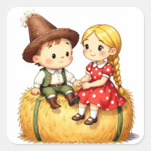 Landkinder auf einem Heuballen