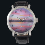 Landschaftlich rosa Landschaft Armbanduhr<br><div class="desc">Schöner rosa Sonnenuntergang über einem ruhigen See mit einer Baumreihe im Hintergrund. Eine schöne Mischung und Mischung von bunten Wolken,  die rosa,  blau,  lila und gelb sind. Phantastische und launische Beleuchtung,  Schatten und Reflexionen.</div>