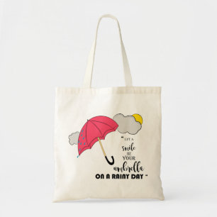 lassen Sie ein Lächeln Ihr Regenschirm an einem Tragetasche