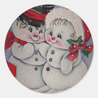 Lasst es schneien. Schneemann seine Freundin  Runder Aufkleber