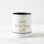 Lead With Your Left - Ceramic Mug w/Black Accents Tasse<br><div class="desc">Begin your day with a fresh perspective! This charming mug showcases the inspiring 'Lead With Your Left' message in gentle gold lettering on a bright white background, complemented by a sleek black handle and interior for a contemporary touch. Perfect for left-handed creators, students, or anyone who leads with purpose. It's...</div>